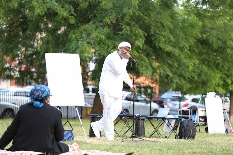 Andres Hernandez speaking into a microphone